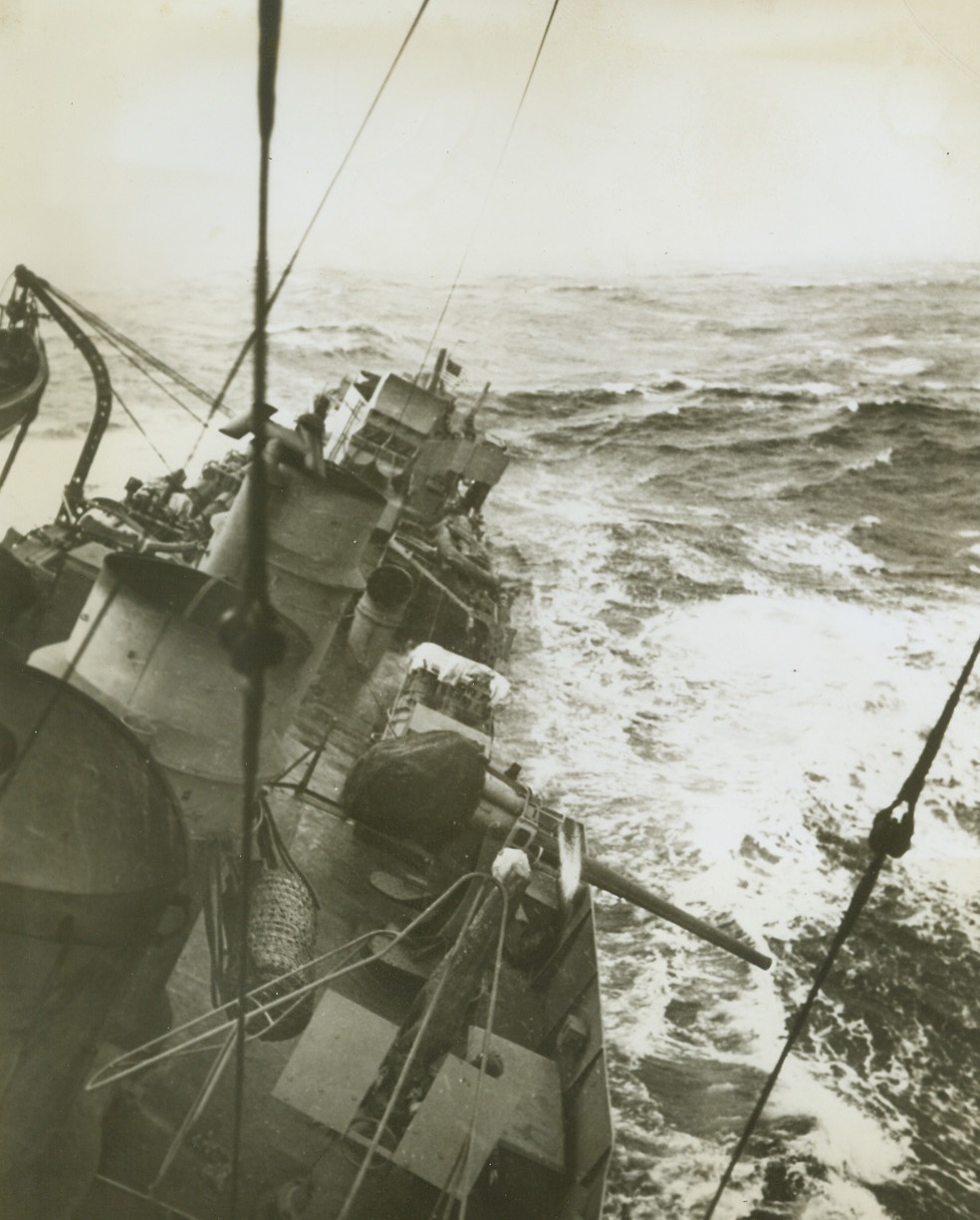 Decks Awash, 6/10/1943. Somewhere in the North Atlantic—No need to swab the decks today—for a rough sea is doing an efficient washing job on this U.S. destroyer as it makes its way across the North Atlantic in heavy weather. The naval vessel escorted a United Nations convoy through rough, sub-infested seas. Credit: Official U.S. Navy photo from ACME.;