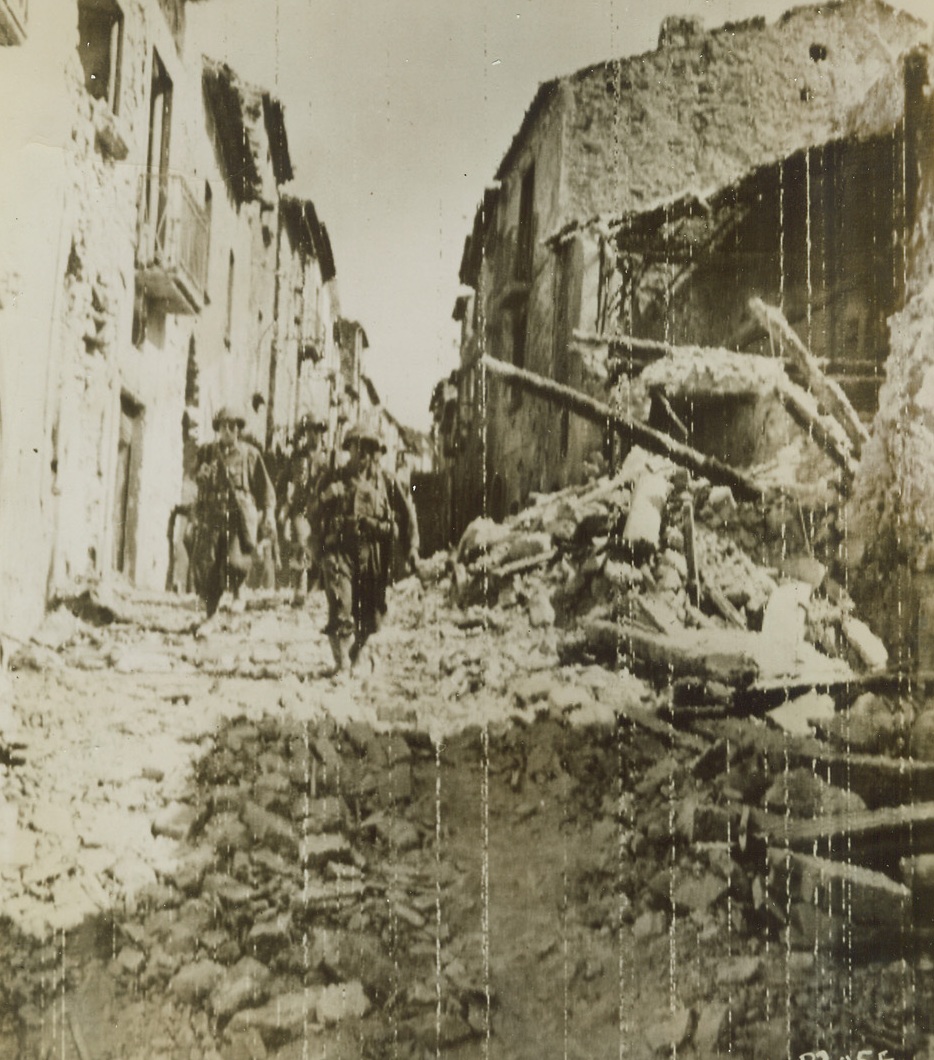Yanks Take Altavilla, 9/26/1943. ALTAVILLA, ITALY – Members of an engineer combat team patrol the streets of Altavilla soon after the Italian town was captured by American troops. Credit (Signal Corps Radiotelephoto from Acme);