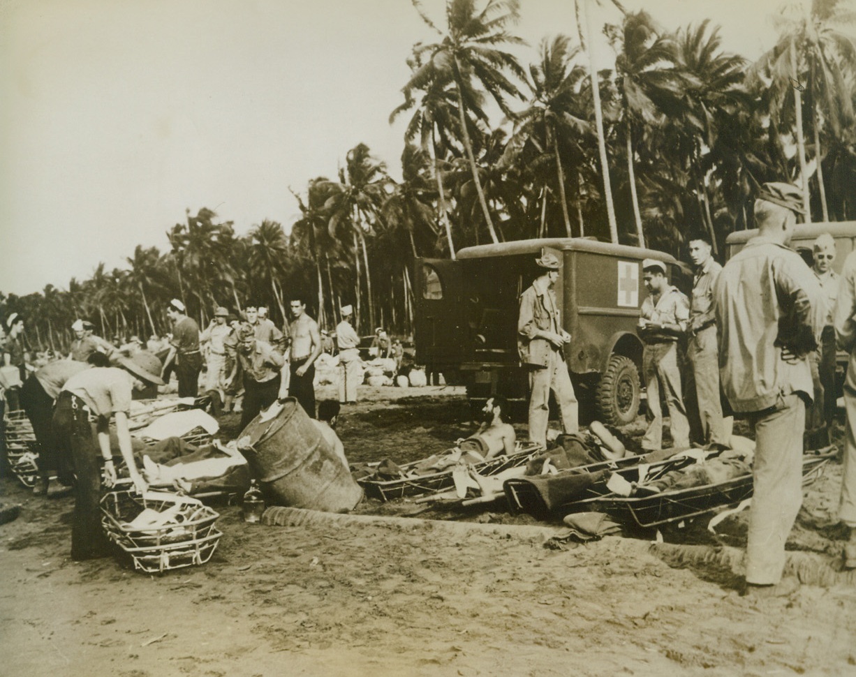YANK CASUALTIES, 9/29/1943. GUADALCANAL—Casualties, American fighters wounded on the New Georgia front, are made ready to be transferred to hospital ships at Guadalcanal, near base for the renewed South Pacific offensive. Most of the men were brought out by fast transports and battleships, while others were evacuated from the fighting front by plane. Credit: U.S. Marine Corps photo from Acme;