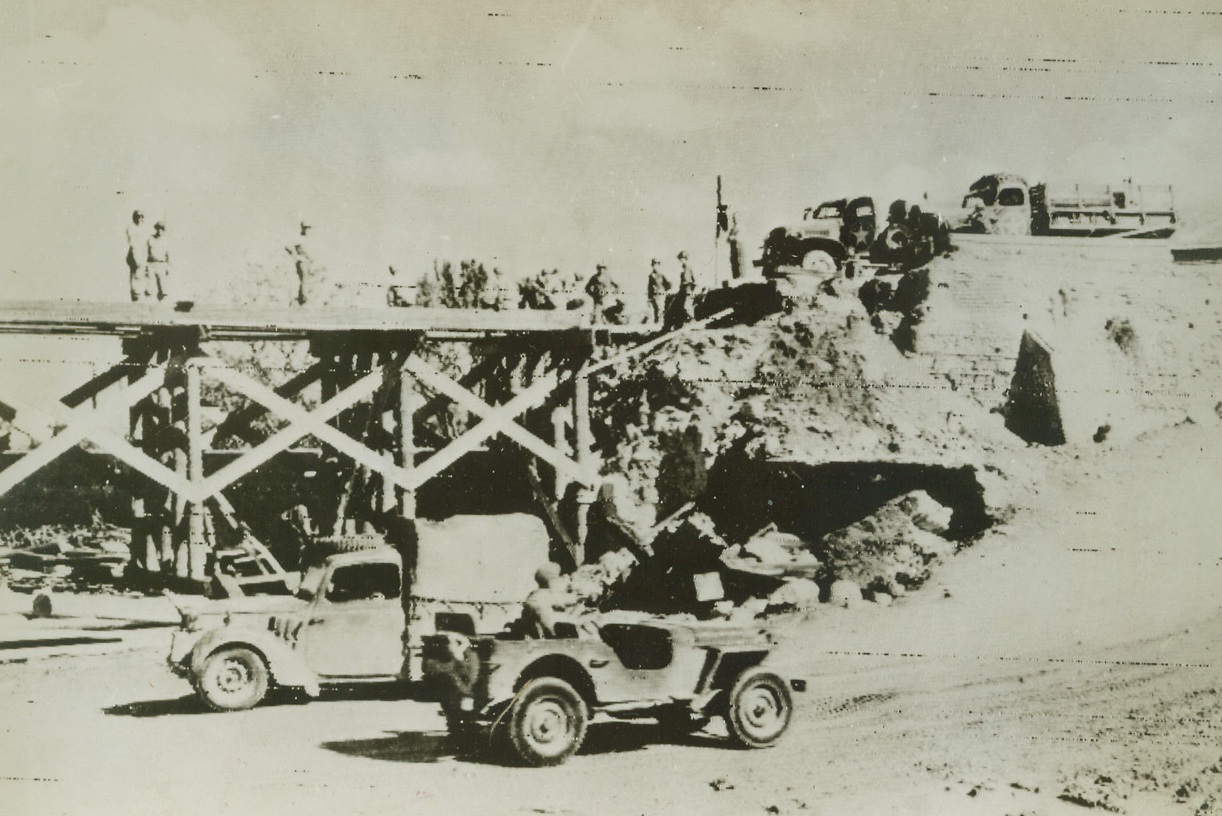 Repairing Wrecked Bridge Near Salerno, 9/16/1943. American engineers of the U.S. 5th Army, Repair a bridge in the Salerno area wrecked by retreating German forces. Today, after the heaviest fighting in the Mediterranean Campaign, Americans and British under Lt. Gen. Mark W. Clark, are forcing the Germans back. 9/16/43 Credit line (OWI Radiophoto From ACME);