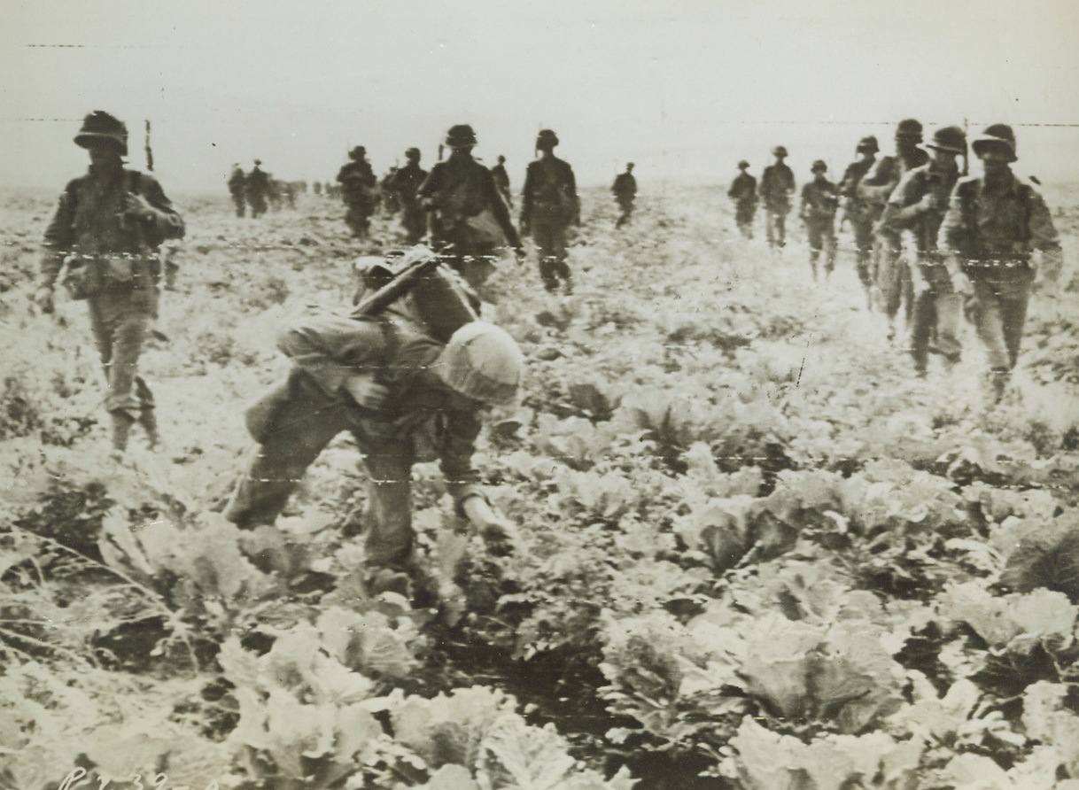Good Pickings, 10/16/1943. ITALY – War isn’t always mud, sweat and blood. Here’s a member of an advancing group of American infantrymen who found good pickings in a tomato patch during advance on Ponti, Italy. Latest dispatches say Germans have retreated to new defense positions along Garigliano River only 80 miles from Rome. Credit Line (Signal Corps Radiotelephoto from ACME;