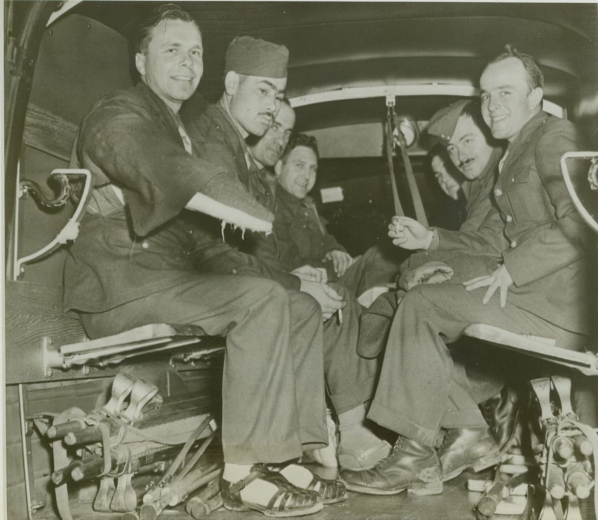 FIRST AMERICAN WOUNDED REPATRIATED FROM GERMANY, 11/2/1943. WASHINGTON, D.C. – Fourteen wounded American soldiers, the first to be repatriated from Germany under an agreement for the exchange of sick and wounded prisoners, arrived by plane at the National Airport and were immediately transferred to Walter Reed Hospital. Shown in the ambulance at the airport-left to right: Sgt. Edwin N. Nelson, Marshall, Minn.; Pvt. Robert M. Scott, Greensboro, N.C.; Staff Sgt. Lester F. Miller, Hartford, CT.; Tech. Sgt. John H. Gardner, Yoakum, Texas; Staff Sgt. Norman C. Goodwin, Bradford, Mass.; Tech. Sgt. Frank J. Bartnicki, Baltimore, MD.; and Pfc. Herbert L. Ehrich, Brooklyn, N.Y. Credit: U.S. Army photo via OWI Radiophoto from ACME;
