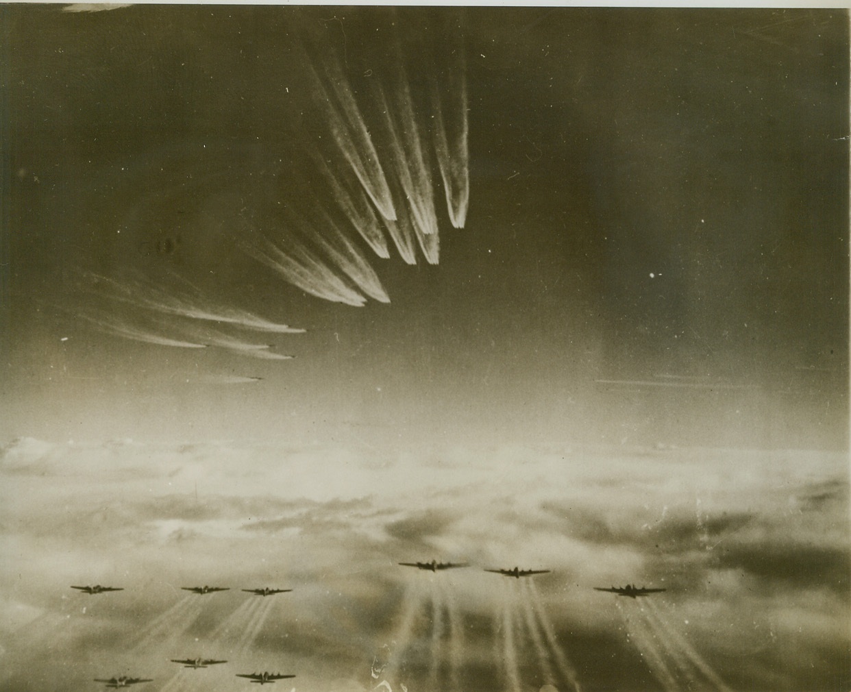 Sky Trail Markers, 11/30/1943. Ghostly vapor trails from their motors, mark the flight of these heavyweights of the U.S. Army 8th Air Force as they head for another of the "Level Germany" air attacks with which the Allies hope to bring the Nazis to their knees. This raid, which took place last Nov. 13, was directed against the submarine yards and docks at Bremen. In lower part of the photo, are Flying Fortresses, while other Forts and Liberators are in the formation above them, (top, center in photo). Credit: (U.S. Army Air Forces Photo from ACME);