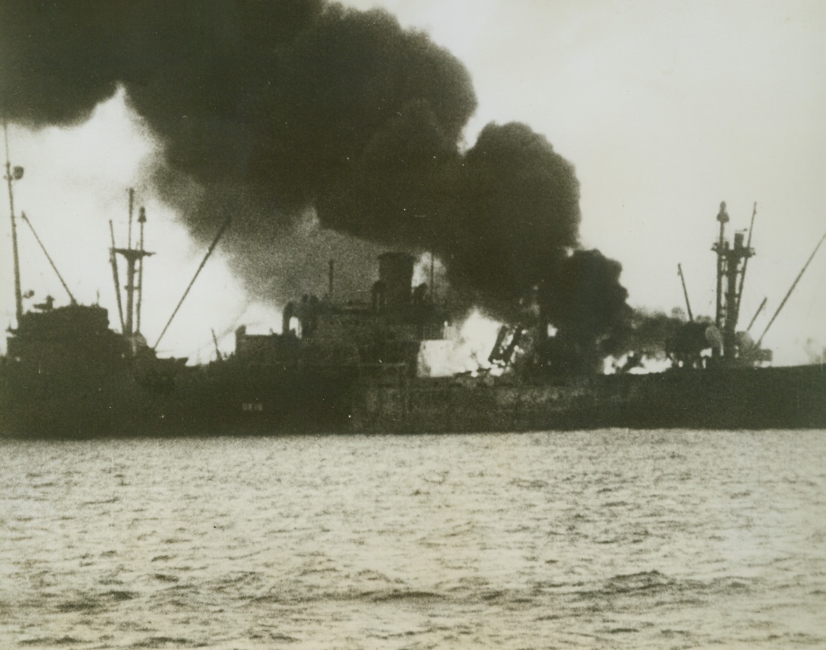 Liberty Ship Bombed by Japs, 11/30/1943. South Pacific – A Liberty ship which had carried a valuable cargo of oil to allied forces in the South Pacific, reaching its destination after a two-month journey, burns fiercely after being hit by bombs from a Jap plane.  Most of the ship’s cargo was unloaded safely.Credit Line (U.S. Army Air Forces photo from ACME);
