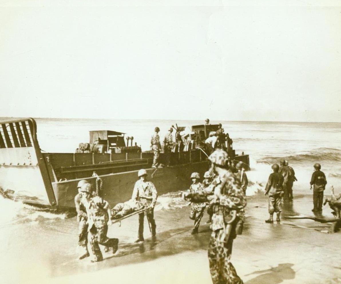 Some Return Quickly, 11/16/1943. Bougainville -- Some of our fighting men return quickly from battle. American Marines and Coast Guardsmen remove wounded assault troops from the beach at Empress Augusta Bay. The injured Yanks are being carried back to a Navy transport. 11/16/43;