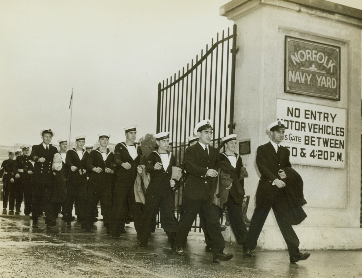 BRITISH SAILORS HARVEST AMERICAN CORPS, 10/23/1942. English sailors on leave from a British man o’war in a U.S. Navy Yard for refitting, lend a hand to Virginia truck and dairy farmers beset by a shortage of manpower.  Here a group of sailors march from the Navy Yard en route to do their bit of farm work.Credit: Acme;