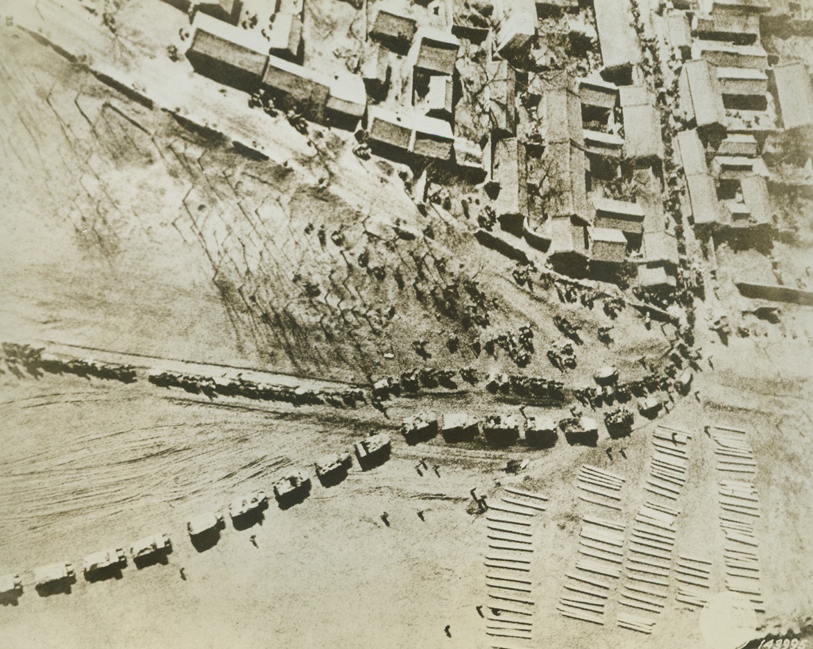 Japs in China Have Transportation Troubles, 11/19/1942. Lacking adequate transportation facilities to get their men, guns, ammunition and supplies to fighting areas, the Japs in China have commandeered everything from horse-drawn carts to wheelbarrows for transportation purposes.   This photo, obtained from an unraveled source, is an aerial view of a Japanese troop movement. Credit line (U.S. Signal Corps photo from ACME);