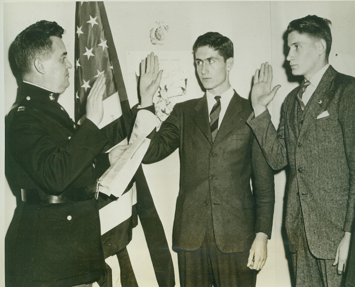 Hatfields and McCoys Patch Up Against Axis, 3/6/1942. CHARLESTON, W. VA. – That bloody mountain feud between the Hatfields and McCoys officially is over for the duration. Pictured proof here shows Edward LaPort, right, whose mother was a McCoy, and Cabell Terry Hatfield, center, taking the oath from Capt. Robert W. Gordon, Marine Corps recruiter at Charleston, W.Va., that they will blast the Axis and not each other. Credit: (ACME);