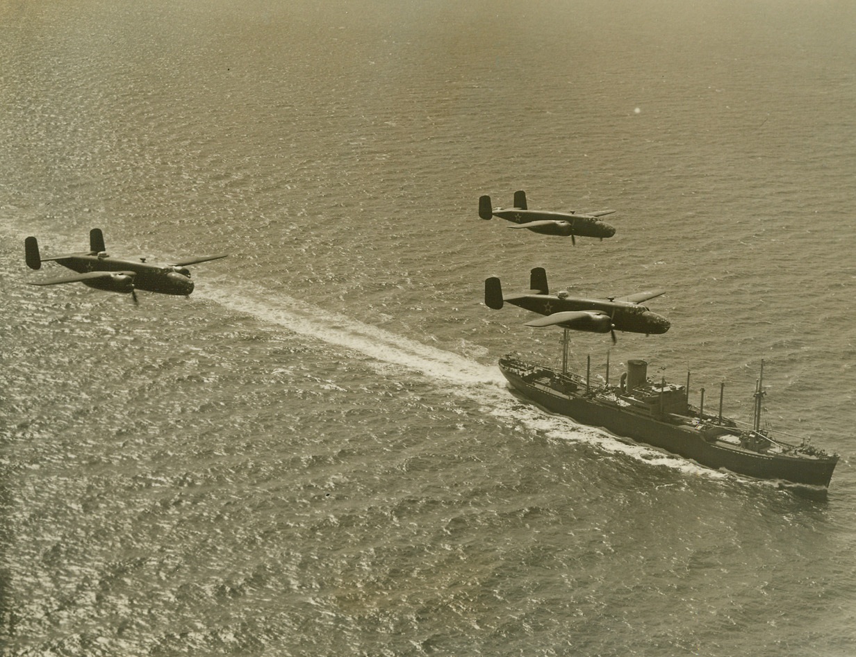 American Bombers on Atlantic Patrol, 3/24/1942. The Atlantic Ocean – Over a seagoing vessel three Army B-25 bombers roar during their ceaseless patrol of the Atlantic coast, ever alert for enemy planes, surface ships or submarines. It is these planes and their fellows in the Army and Navy Air Forces which have been charged with the defense of the U.S. Atlantic Coast and which have sunk an unannounced number of submarines operating in that area. They are part of the command of Maj. Gen. Follett Bradley, head of the Air Forces, Eastern Defense Command and First Air Force. Passed by U.S. Censor. Credit: ACME;
