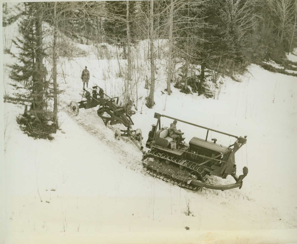 HELPING LAY NEW HIGHWAY TO ALASKA, 4/3/1942. NELSON, B.C.—Highway building equipment bound for an advance point on the new highway from the U.S. to Alaska crosses Cutrank River in isolated British Columbia territory. Credit: OWI Radiophoto from ACME;