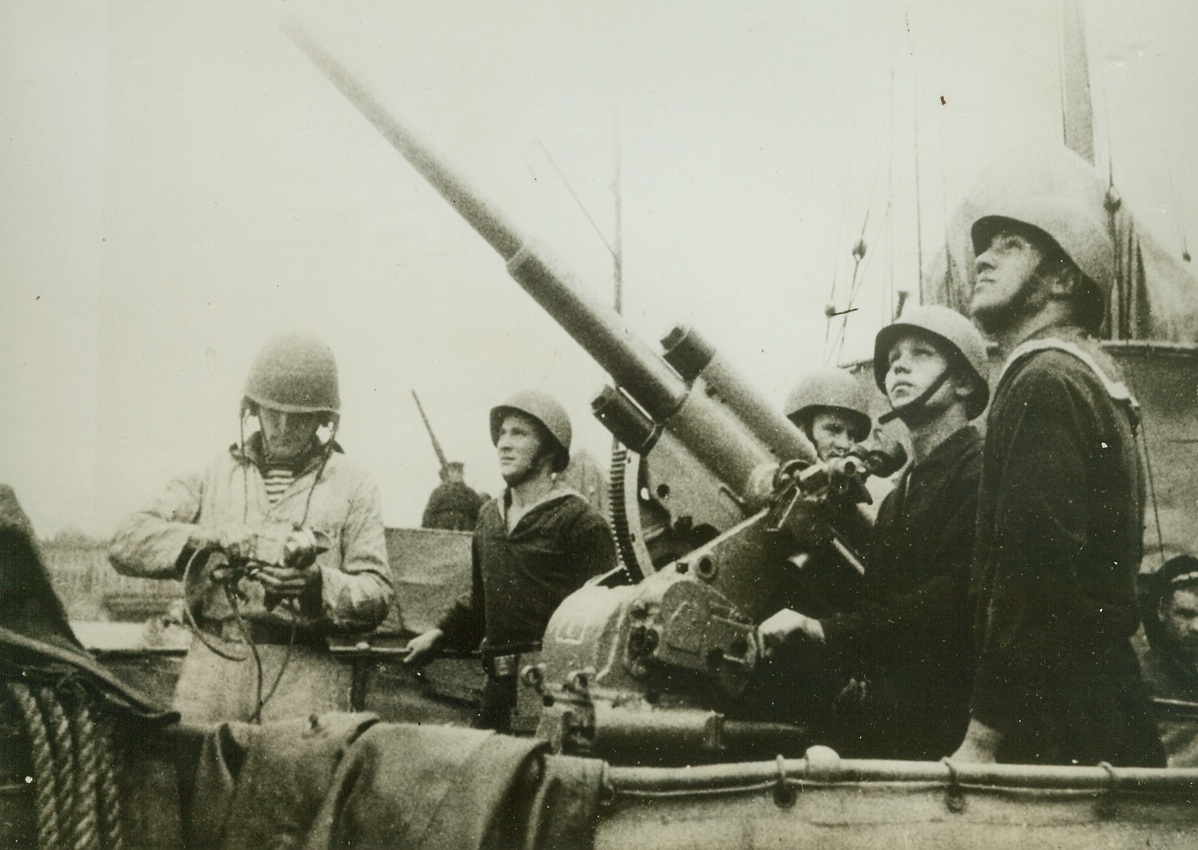 In Defense of Leningrad, 4/17/1942. Leningrad, Russia—Soviet anti-aircraft gunners of a Soviet warship at Leningrad stand ready to repulse attacks by German aircraft on the city as might Russian attacks farther north and south attempt to relieve the enemy siege of the city. Passed by censor. Credit: ACME.;