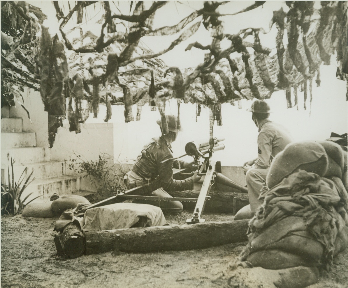 READY IF THE JAPS RETURN, 5/6/1942. HAWAII – Two soldiers man a gun installed on a private estate in Hawaii. The island defenders are ready, willing and able to meet the Japs if they return. Credit: ACME;