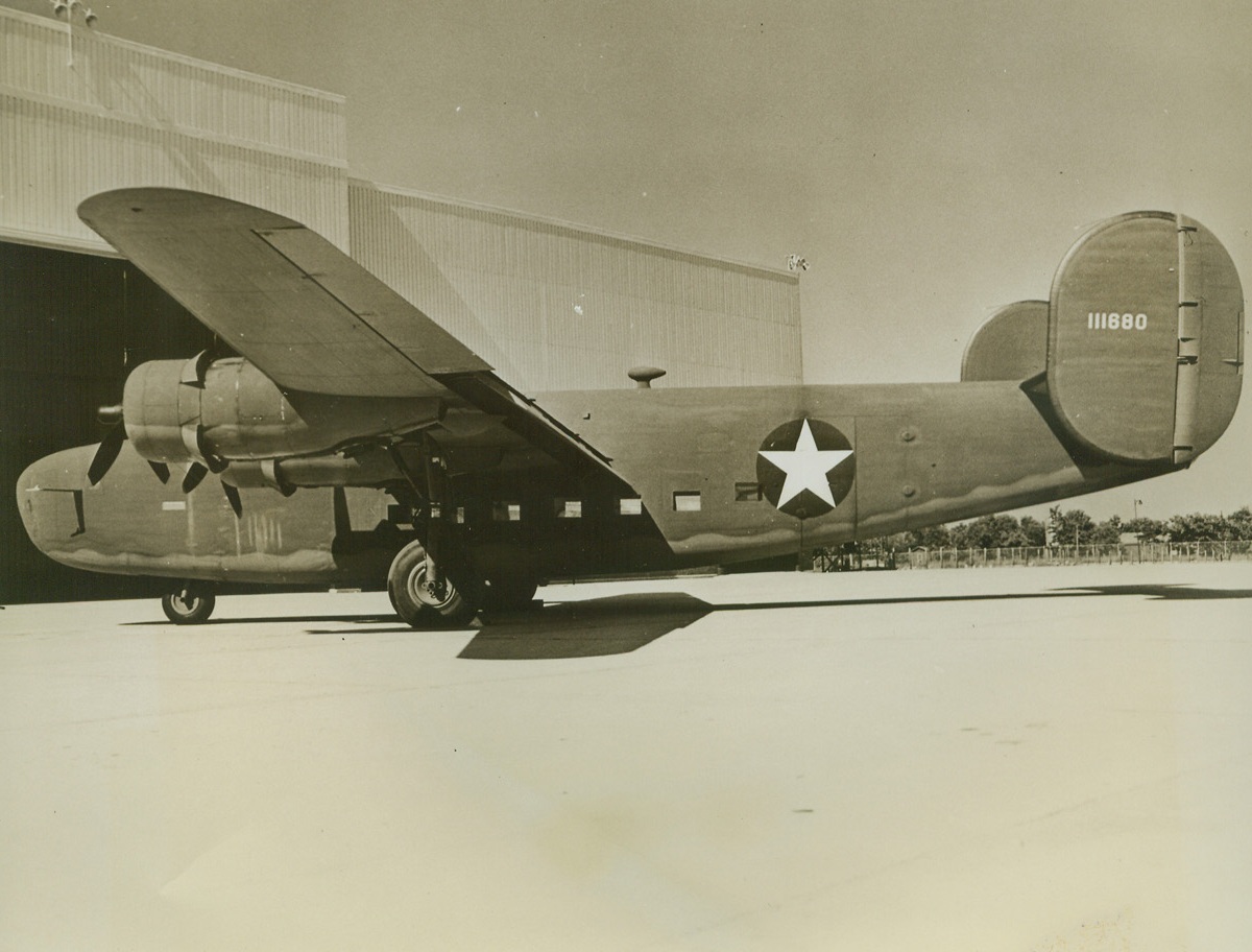 Sky Transport, 8/27/1942. This super transport plane was launched by Consolidated Aircraft Corp. at its Texas plant more than a month ahead of schedule. The new long-range transport, a conversion of the Consolidated B24 Liberated Bomber, is now in mass production. The four-engine ship incorporates all the desirable features of the 20-ton bomber and will carry a pay-load cargo of 10 tons, fly faster than 300 mph, and range 4,000 miles. Inauguration of the transport assembly line gives Consolidated’s Texas plant the longest, continuously-moving straight production line in operation in the aircraft industry. Production of super transports means no halt in production of Liberator bombers.Credit: ACME.;