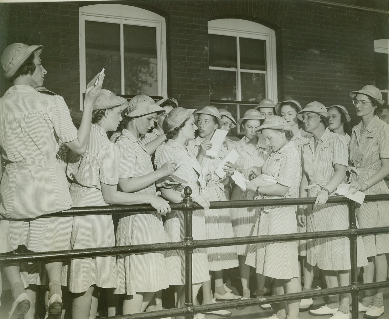 Mail Call at WAAC Camp, 8/9/1942. Fort Des Moines, Ia. – Women of 1st Regiment officer training school of Women’s Army Auxiliary Corps at Fort Des Moines, Ia., receiving mail from Murl Fodness of Ellendale, North Dakota. Credit: (ACME);