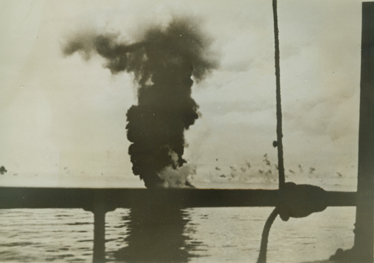 Failure of a Mission, 9/29/1942. Solomon Islands – Here’s a close-up view of an exciting “near miss” during a Jap attack on the U.S. defenders of the Solomons.   That cloud of black smoke marks the uncomfortably close demise of a Jap bomber which had attempted to crash into the ship from which the picture was taken.  The vessel’s anti-aircraft guns brought it down just short of its goal.  Action took place between Guadalcanal and Tulagi.   Credit line (ACME);