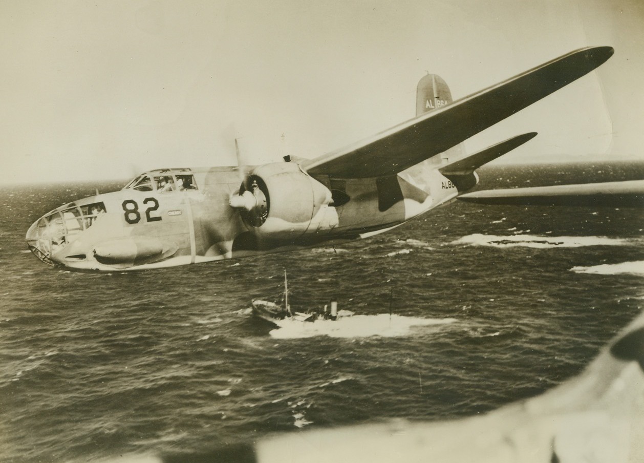 Hawk-Eyed Rescue, 9/18/1942. Washington – The battered hulk of a merchantman, rapidly breaking up on an Atlantic coastal reef, brings a Douglas A20 Bomber zooming down in a 452 mph dive. Lieut. C. T. Baumgarner, U.S.A., of North Carolina, pilots the light fighter bomber over the rocky North Atlantic coast, and leads a sweep of similar planes, on the look-out for submarine damage. Passed by Censor Credit: ACME;