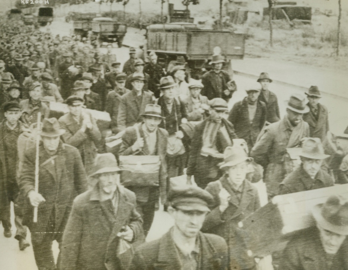 GERMAN PRISONERS LEAVE FRANCE, 10/4/1944. Rounded up on the Western Front, these Germans are shown on their way to prisoner of war camps in England. They were members of civilian groups working on fortifications and in other types of labor battalions. Credit: Army Radiotelephoto from Acme;