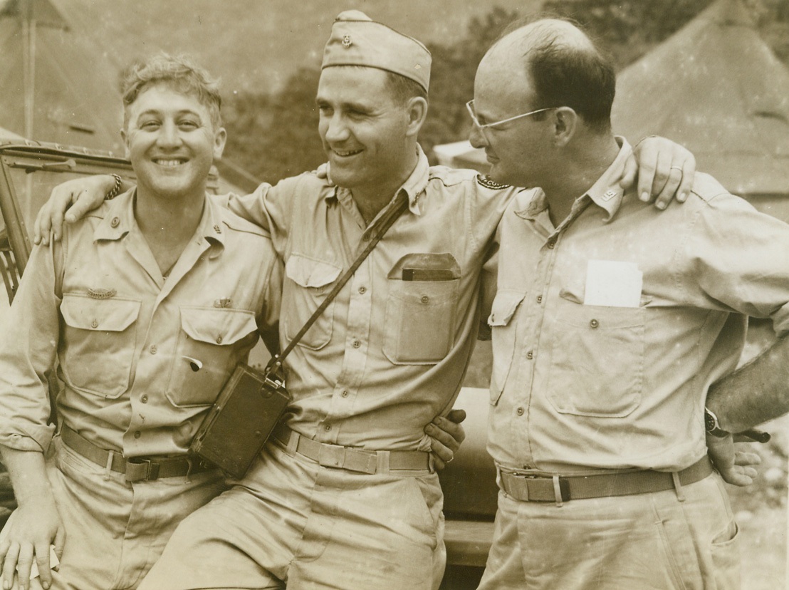 ACME Reunion in New Guinea, 10/14/1944. Dutch New Guinea – It was practically old home week in Dutch New Guinea when ACME news pictures’ photographers (left to right) Frank Prist, Stanley Troutman and Tom Shafer found themselves together in the same area. Credit line (ACME);