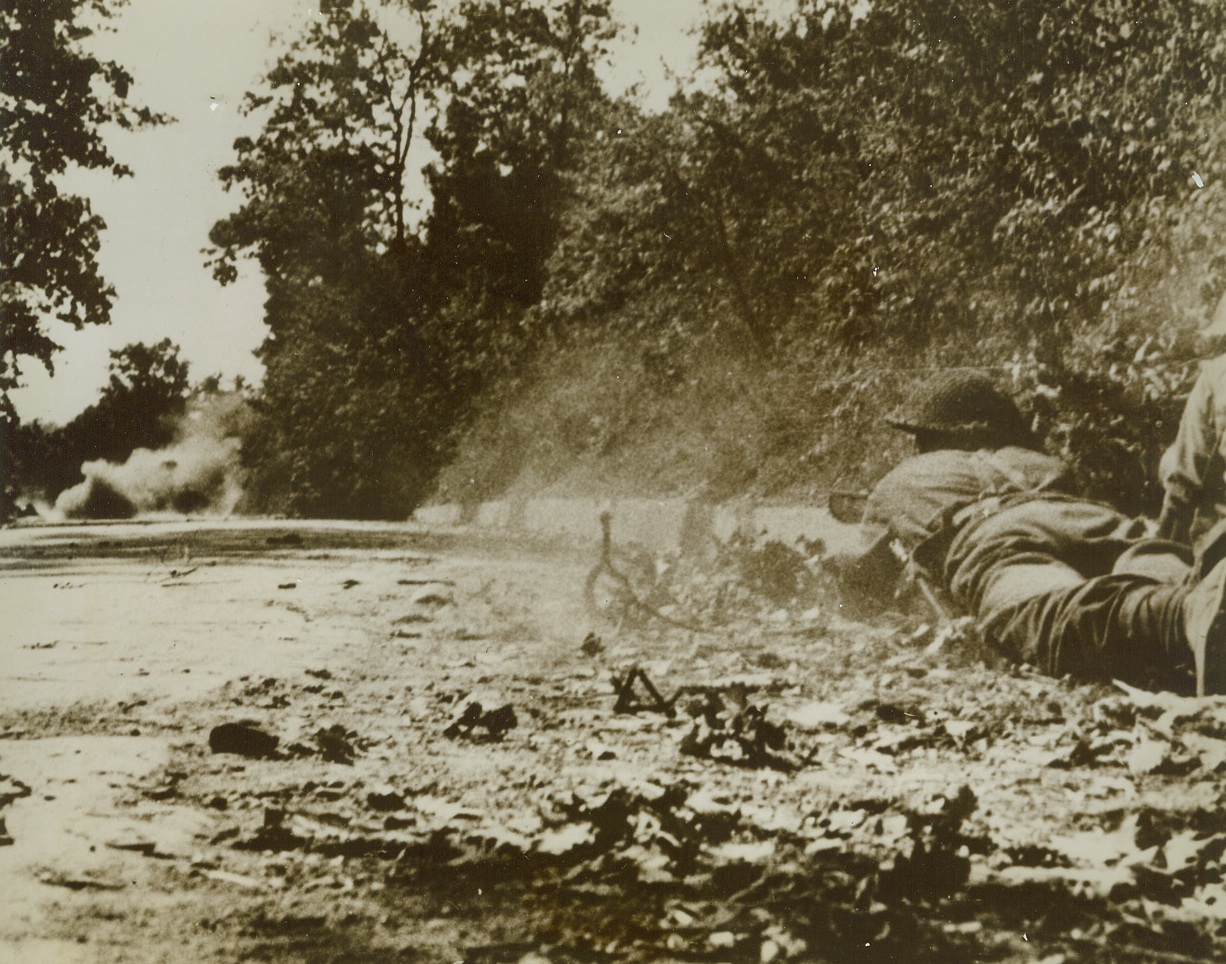 BRITAIN’S CRACK ANTI-TANK GUN IN ACTION, 2/20/1944. ITALY—This action photo shows the precise moment when the two-and-three quarter-pound bomb projected from a PIAT gun hits its target at short range. The target, a German Mark IV tank, is behind the cloud of smoke in background. A new weapon, the PIAT (Projector Infantry Anti-tank) gun can be used with deadly efficiency against concrete pillboxes and machine gun nests as well as tanks. Credit Line (ACME);