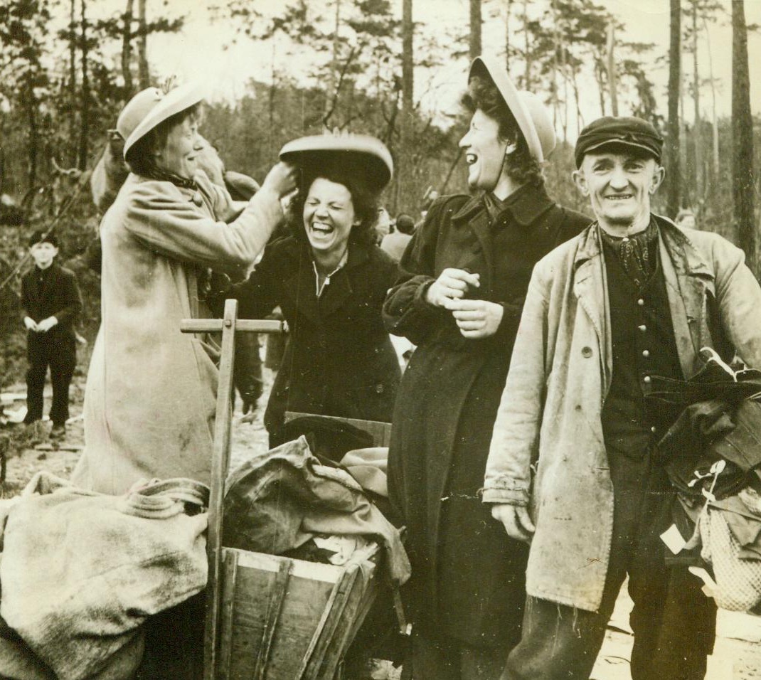 Easter Bonnets For Free, 4/1/1944. Germany – Women in Frankfurt have quite a time with their new bonnets which they looted from a train carrying wine and clothing. Train was halted by an Allied air attack on area and was wiped clean of its cargo Credit Line (ACME);