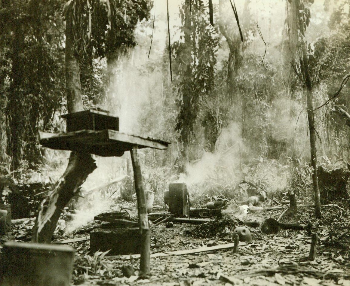 Hara Kiri By Error, 4/14/1944. Empress Augusta Bay -- This still smoldering Jap soldier committed Hara Kiri -- But it was not intentional. In the Japanese breakthrough on the Empress Augusta Bay perimeter, this Jap entered the American command post and attempted to destroy a food dump with an incendiary grenade. Also stored in the building were some flame throwers which were ignited by the grenade and burned the soldier before he could escape the flames 4/14/44 (ACME);