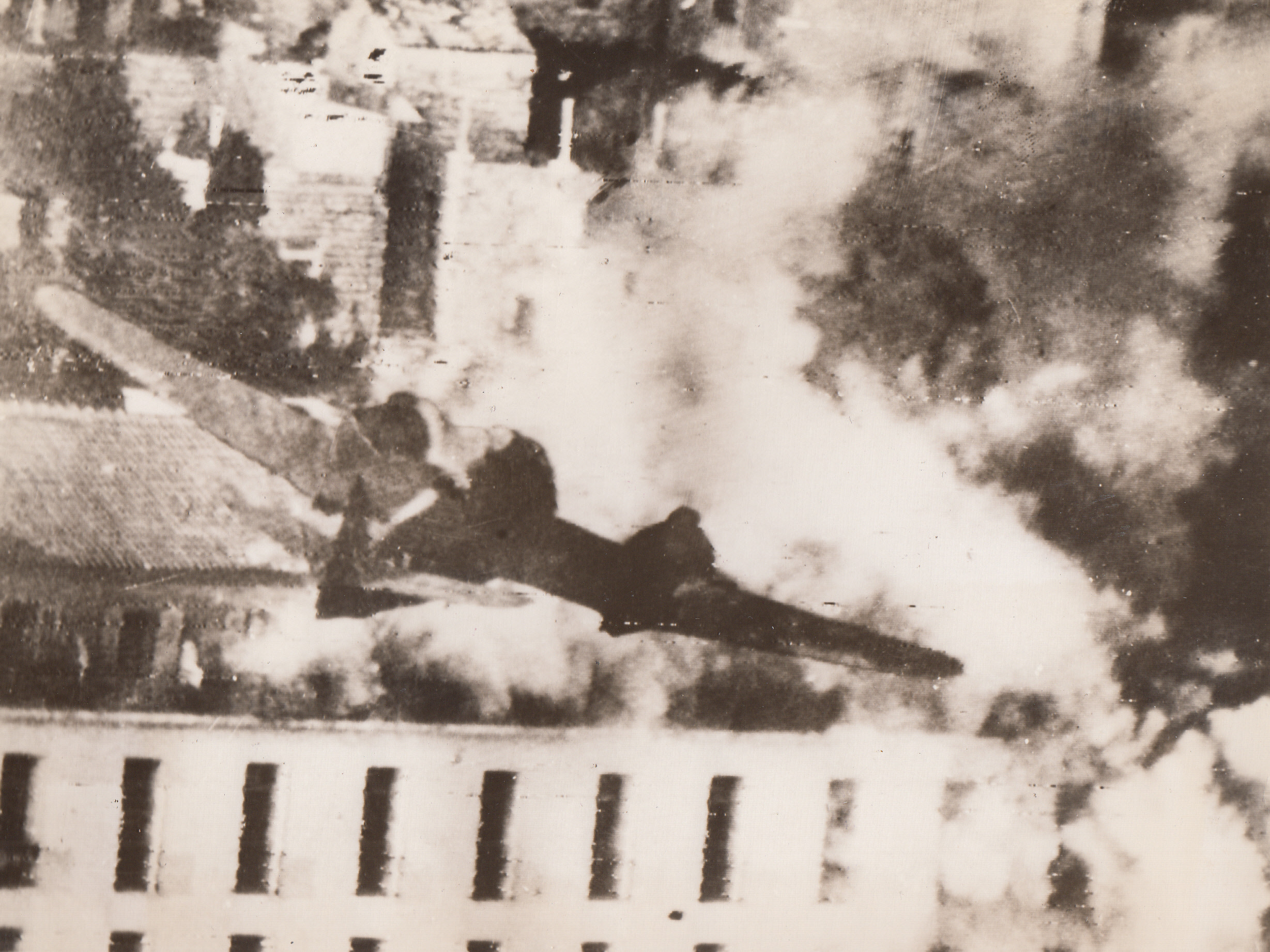 COMING IN A ROOF-TOP LEVEL, 8/22/1944. YUGOSLAVIA—A rocket-carrying Beaufighter of the Balkan Air Force goes in at roof-top level to loose its cargo of destruction on the already smoking building, suspected of being German headquarters, in Dubrovnik, Yugoslavia.;