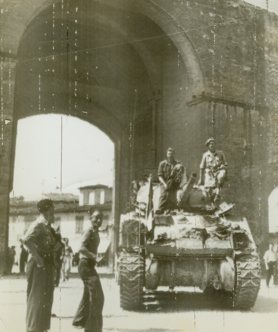 British Tank Enters Florence, 8/8/1944. FLORENCE, ITALY – Crewmen stand atop their British tank as it enters Florence through the Porta Romano. It is manned by soldiers of the South African unit of the British 8th Army, which were first to enter Florence.Credit (British Official Radiotelephoto via OWI from ACME);