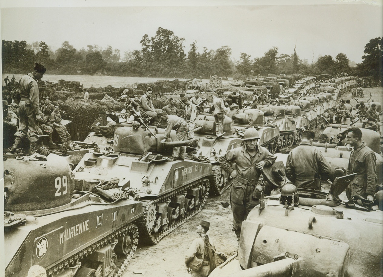 Free French on Way to Free France, 8/15/1944. Free French troops with their armored vehicles shown at a transient area somewhere in the European Theater of Operations just before hopping to the Continent in support of the Allied attack to free France from the Nazis. Credit: (Signal Corps Photo from ACME);