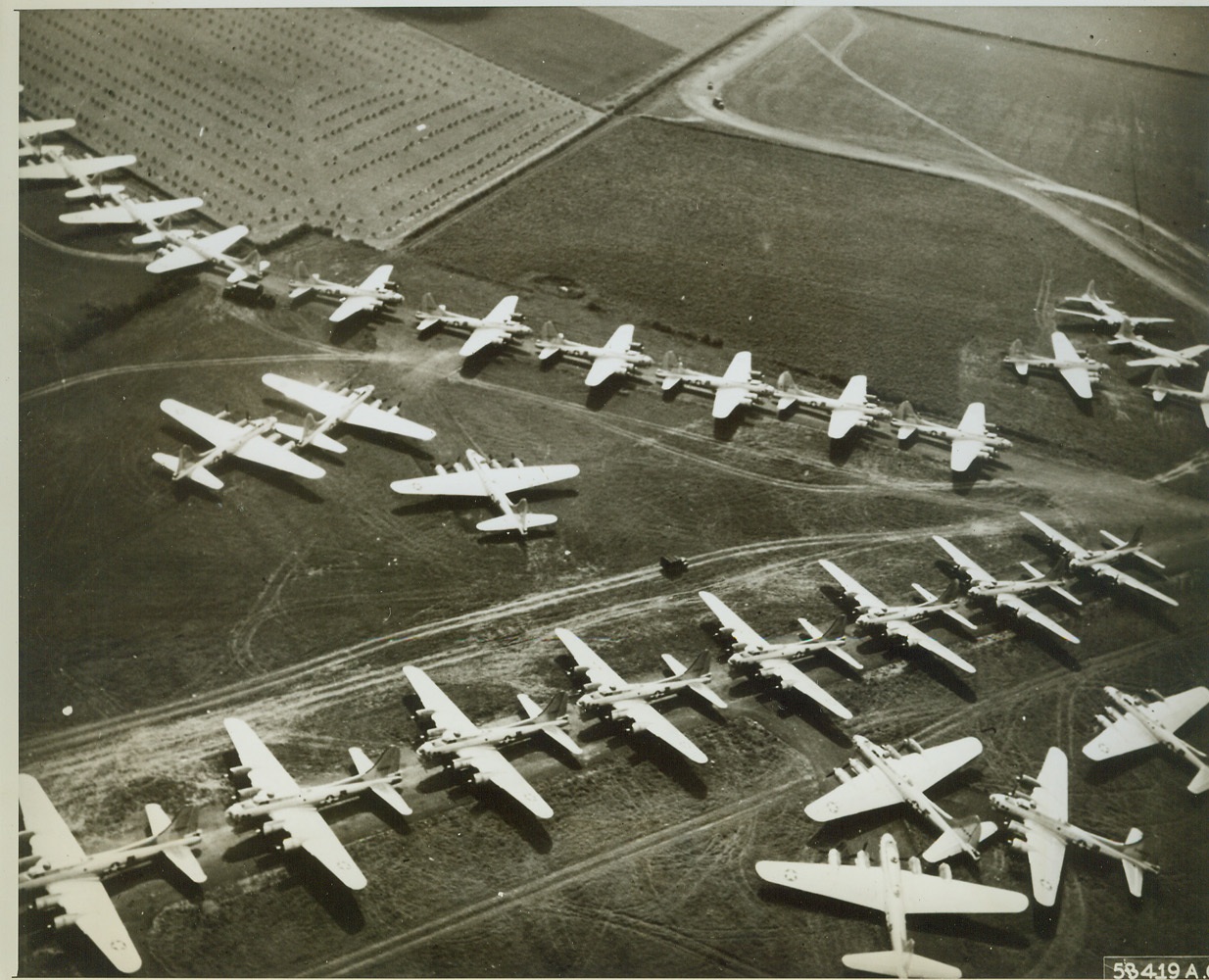 Aerial Might on Display, 8/23/1944. ENGLAND -- A tribute to American labor and production power one of the largest group of B-17 Fortresses ever seen together in the confines of a photograph are lined up and ready for combat. This is only a small portion of the aerial might which is assembled in England as replacements for the strategic bombers of the U.S. Army 8th Air Force. Credit (USAAF Photo from ACME);