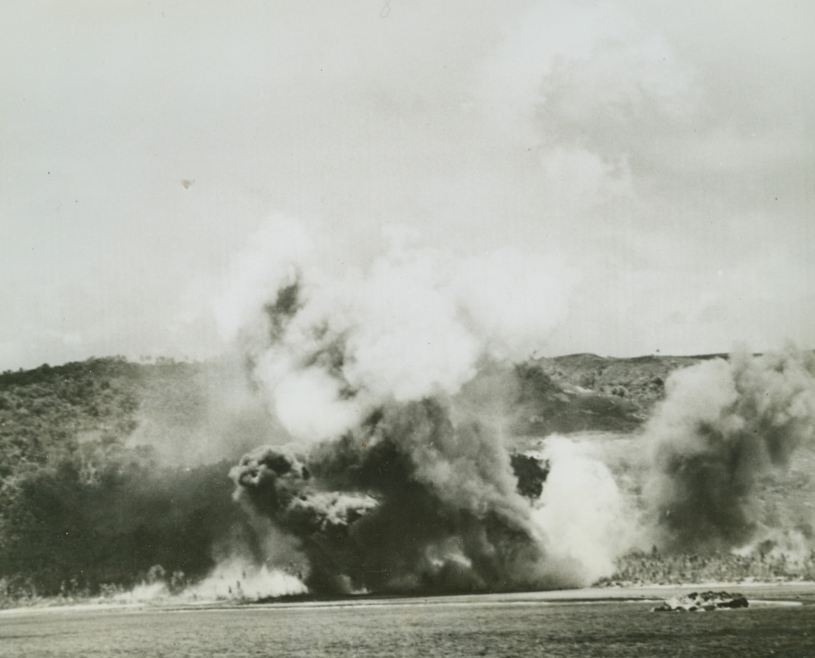 Pre-Invasion Bombardment on Guam, 8/2/1944. Guam Is. – Grey and black smoke rises in huge billows from the shores of Guam, as US Navy guns and planes hammer at the Jap installation on July 21 to soften it for Marine and Army landing forces.Credit: Official US Navy photo from ACME;