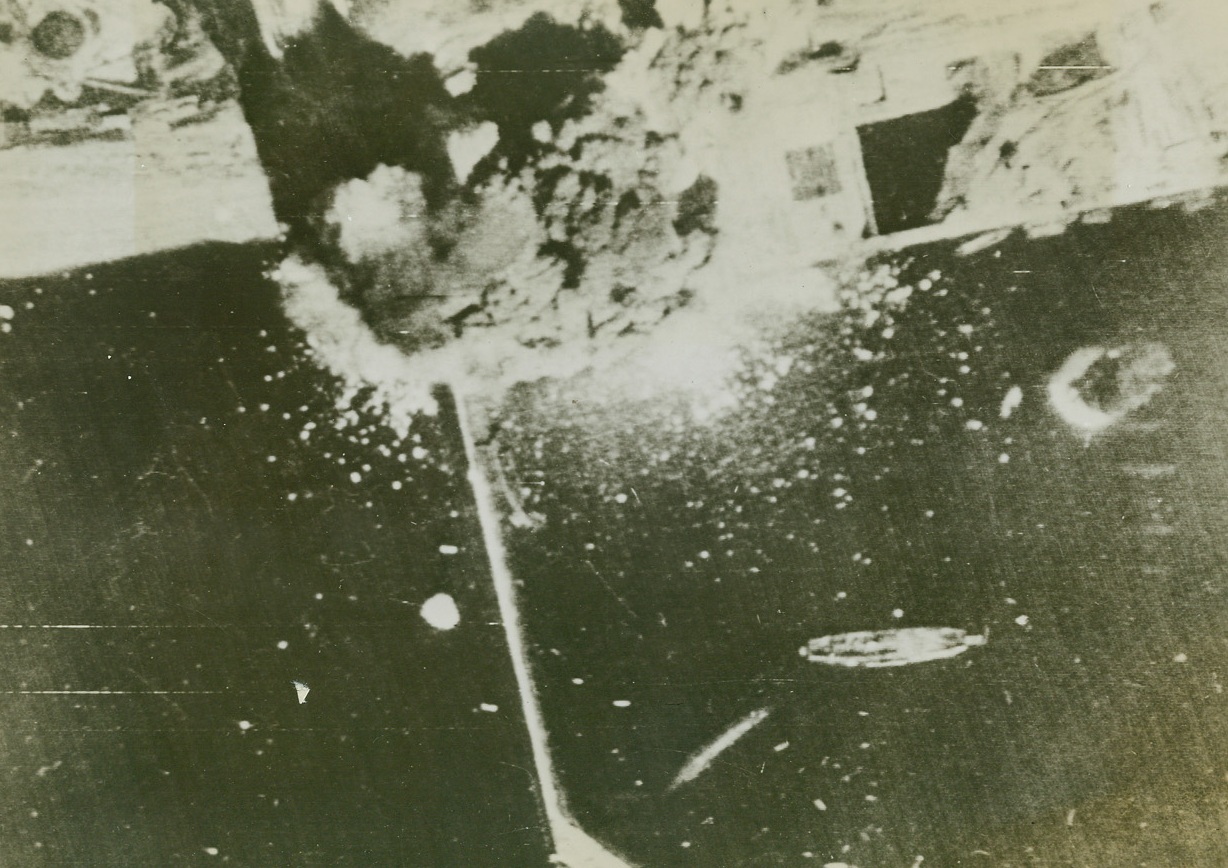 British Bomb Brest, 8/7/1944. Brest, France – Here’s a bomber’s-eye-view of the U-boat pens at Brest as RAF airmen strike heavily at their target. A direct hit is scored by a six-ton bomb on some of the concrete pens. Credit: British official photo via US Signal Corps from ACME;