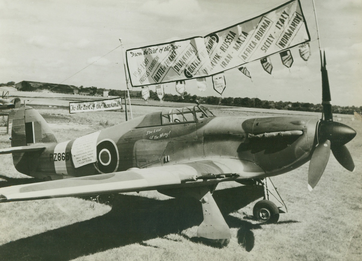 The Last of the Hurricanes, 8/22/1944. England – Fancifully decorated is this, the last Hurricane to be produced by the Hawker Aircraft Company. Banners and pennants describe the many achievements of the famous fighter. Credit: British Official Photo from ACME;