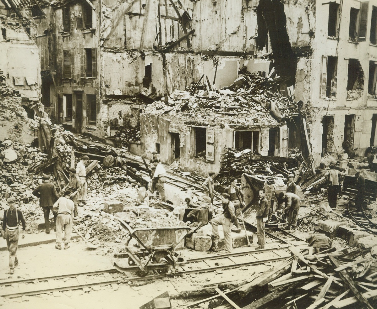 Digging Out After Liberation By American Army, 8/29/1944. MANTES, FRANCE - Damage done by Nazi demolition teams as they left town to Yanks.;