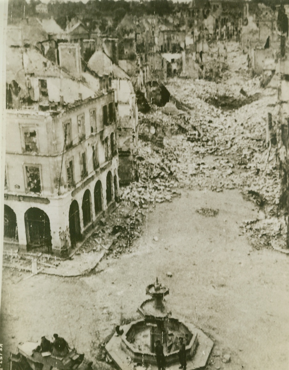 Falaise—City of Destruction, 8/18/1944. France—Heaps of broken masonry line the shell-torn streets of Falaise, France, taken by Canadian troops after hard and bitter fighting. Houses are gutted and the city is but a ghost town after Nazi demolition squads finished their destructive tasks.  Credit: Army radiotelephoto from ACME;