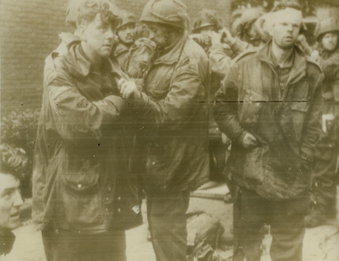BRITISH PARATROOPERS CAPTURED AT ARNHEM, 9/28/1944. ARNHEM, HOLLAND—After nine days of holding out against superior German forces in the Arnhem pocket, these British paratroopers, members of the famed “Red Devil” squadron, were finally captured by the enemy.. Their faces clearly reveal the strain of the lengthy battle, when they fought with their small arms against the heavy guns of the Germans. Yesterday, the remaining paratroopers, 2000 of the approximate 8,000 who landed, were released from the trap by British 2nd Army forces. Almost 1,200 wounded were left behind and Germans say 6,400 were captured. Credit: Acme radiophoto;