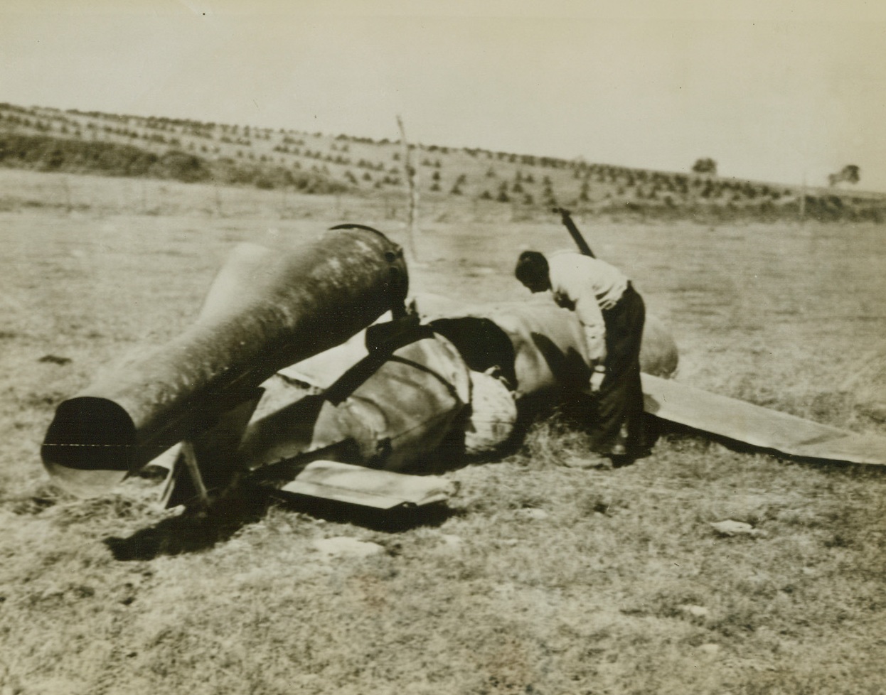 Robomb Misses Target-Misses City, 9/8/1944. France—Almost intact, this flying bomb intended for England missed fire and traveled only a short distance from its launching site to the French city of Foucarmont where it was discovered by Allied forces. Credit: Army radiotelephoto from ACME.;