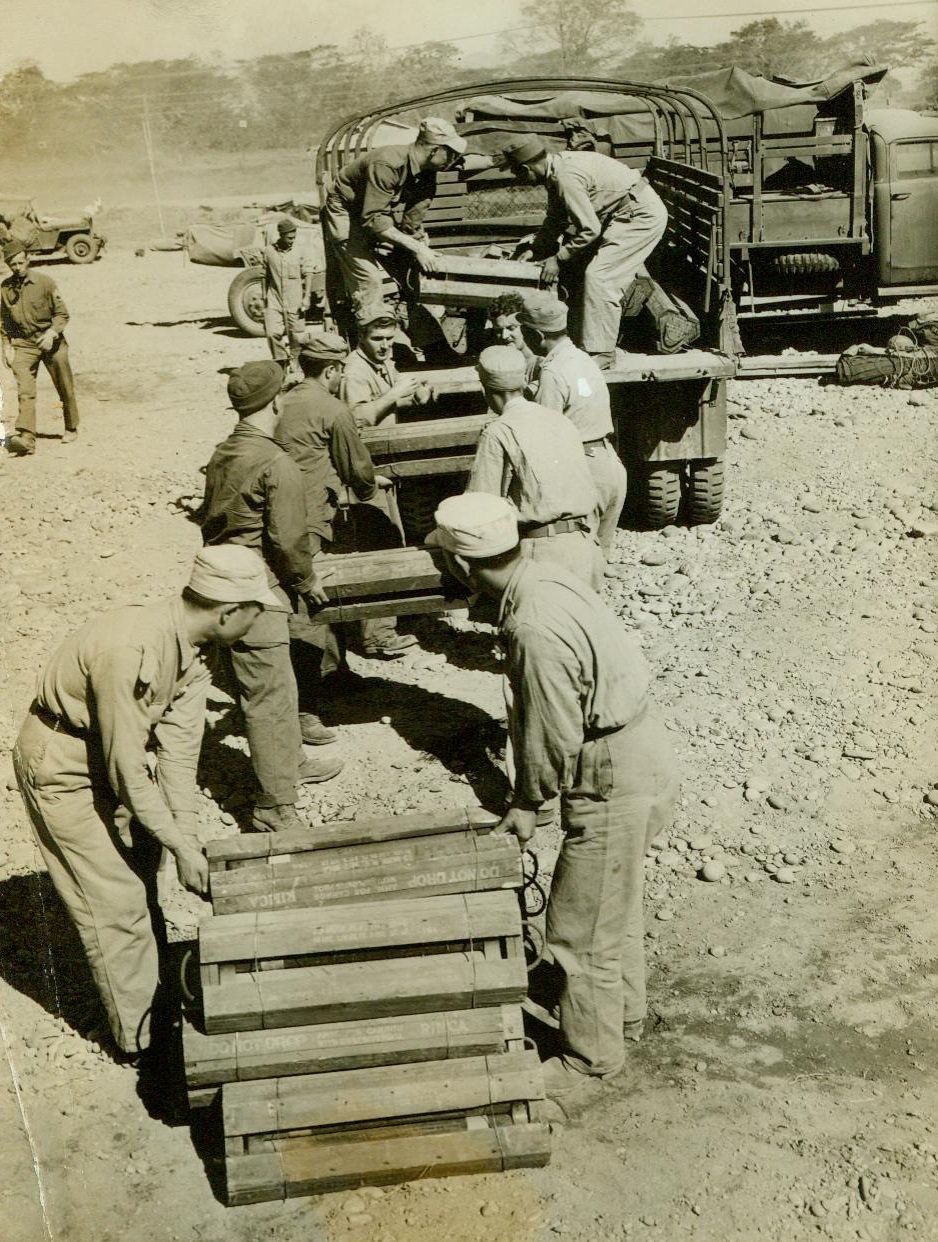 Loading up at Ledo, India, American and Chinese soldiers, 1/31/1945. Loading up at Ledo, India, American and Chinese soldiers pile ammunition into one of the convoy trucks. CREDIT LINE (ACME) 1/31/45;