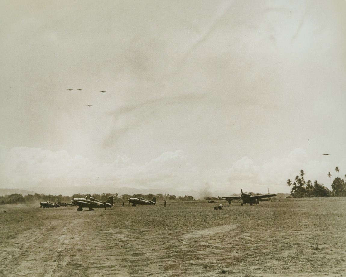 "Up And At 'Em". Guadalcanal – U.S. Marine fighter planes prepare to take off from Henderson field, on Guadalcanal island, to join U.S. Army flying fortresses already in the air.  Both groups on a common mission to blast Japs. Credit line (U.S. Navy photo from ACME);