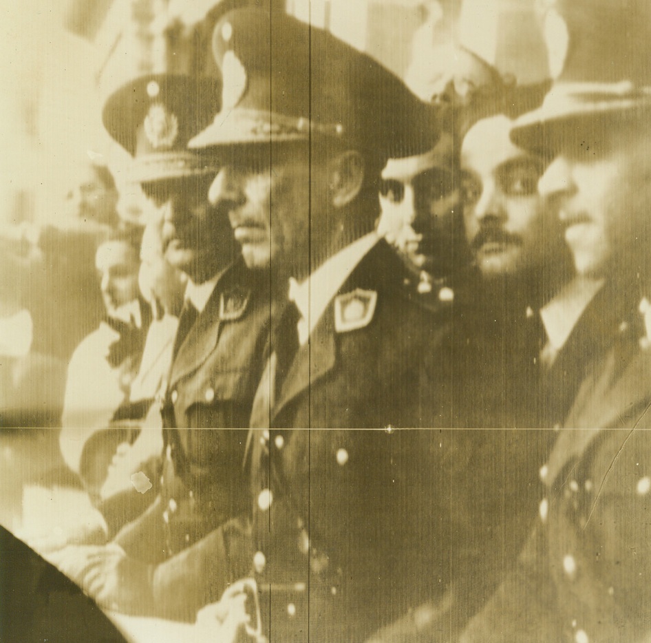 No Title. Gen. Pedro Ramirez (center) and Gen. Arturo Rawson (left) are shown addressing a crowd beneath the Government House balcony at Buenos Aires, Argentina. Photo radioed to New York from Buenos Aires. Passed by censor. Credit: ACME;