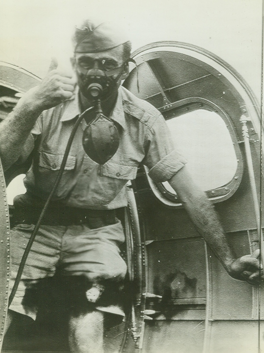 No Title. In one of the first pictures from Australia since U.S. entered war, a crew member of a U.S. Army Air Corps “flying fortress” wears his oxygen mask and gives “thumbs up” sign before taking off on flight. Now in Australia, the ship is one which was been in action against the Japanese in the Philippines.;