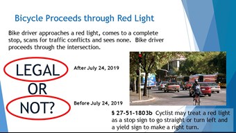 Slide from the Friendly Driver Program explaining the red light as stop law for Arkansas cyclists passed in 2019