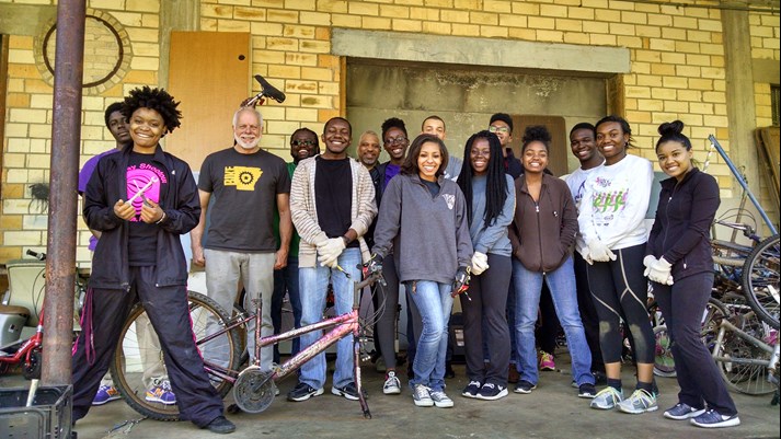 Group shot photo of volunteers with Ron King at Recycle Bikes for Kids.