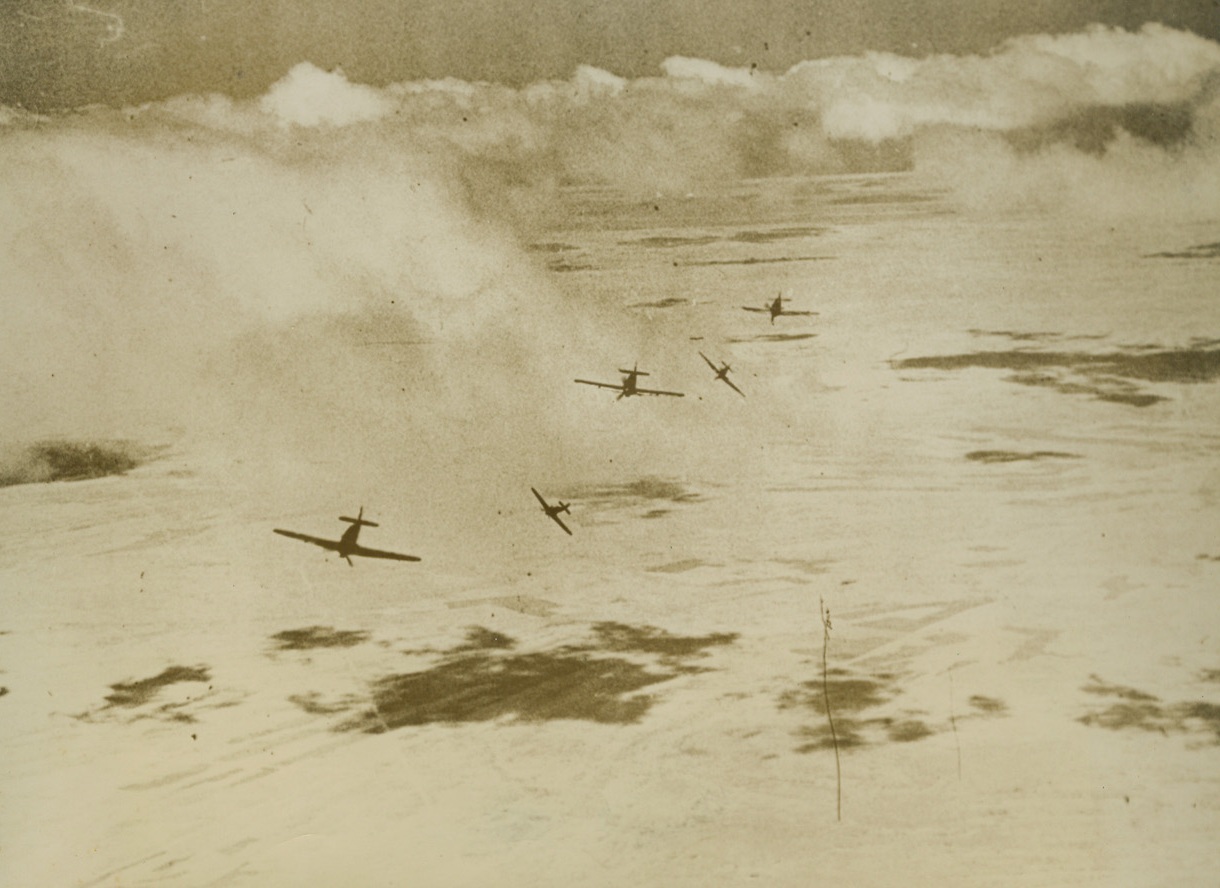 Hurricanes in the Middle East, 12/27/1940  The Middle East – A flight of hurricane fighters on patrol on the Middle East front breaks to attack enemy aircraft reported to them by radio, according to British-censored caption with this striking photo. Credit line (ACME);