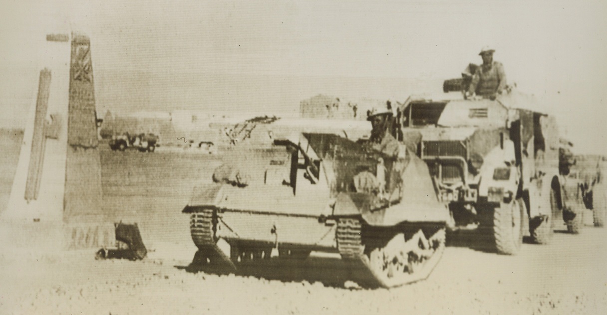 Victorious British Enter Sidi Barrani, 12/29/1940  Sidi Barrani, Egypt - - Past a stone monument erected by the Italians in celebration of their capture of Sidi Barrani, British bren gun carriers and larger armored units roll triumphantly as they retook the strategic desert town.   Credit line (ACME cable photo);