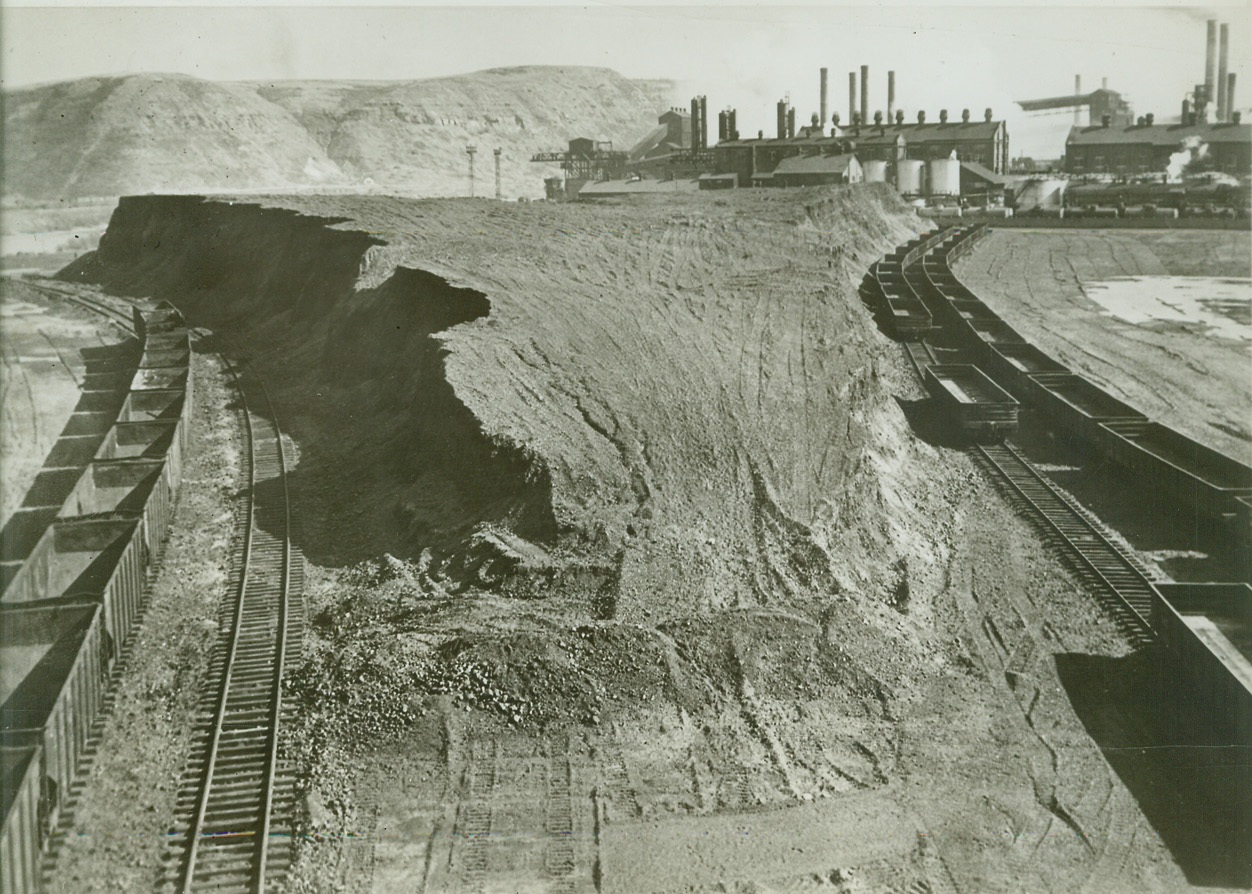 CAPTIVE MINE STRIKE THREATENS STEEL OUTPUT, 10/27/41  CLAIRTON, PA – This pile of coal at the Clairton, Pa., works of the Carnegie-Illinois Steel Corporation looks big, but it will last only two weeks at capacity operation, and prospects of replenishing it are dim as 53,000 miners at pits owned by steel companies stage walkout to enforce C10 demand for a closed shop. Credit: OWI Radiophoto from ACME;