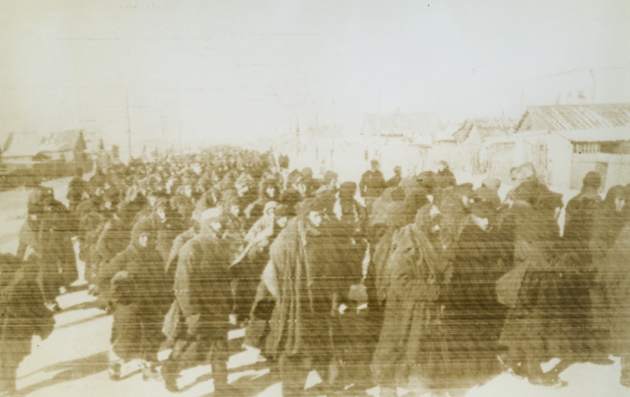 Crowd of Nazi Prisoners, 2/6/1943. Stalingrad, U.S.S.R. – A huge column of German prisoners marches down the street of a village in the Stalingrad area. These are some of the thousands of Nazis who were captured during the final days of the Stalingrad battle of annihilation. Latest reports from the Russian front indicate that Soviet troops are within 15 miles of Rostov. Passed by censors. Credit: ACME Radiophoto;