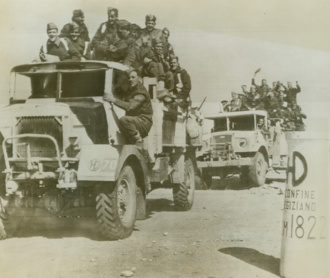 Leaving Their Tank, 2/17/1943. Tripolitania – Crossing the border between Tripolitania and Tunisia, truckloads of men of the highland division pass a signpost at the border that already bears the “HD” that identifies the highland division.  Latest reports received from Tunisia indicate that veteran German tank forces, renewing their powerful drive in South Tunisia, have smashed through to the outskirts of Sbeitla.  Credit line (ACME radio photo);