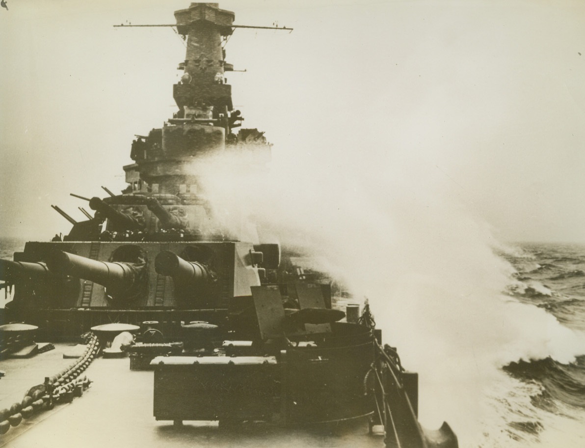 New U.S. Warship on Practice Cruise, 2/3/1943. Cold heavy seas surround this new U.S. battlewagon as it steams ahead on a practice cruise. Sixteen-inch rifles jut out from the two forward turrets while dual-purpose batteries point skyward from amidships. Credit: U.S. Marine Corps photo from ACME;