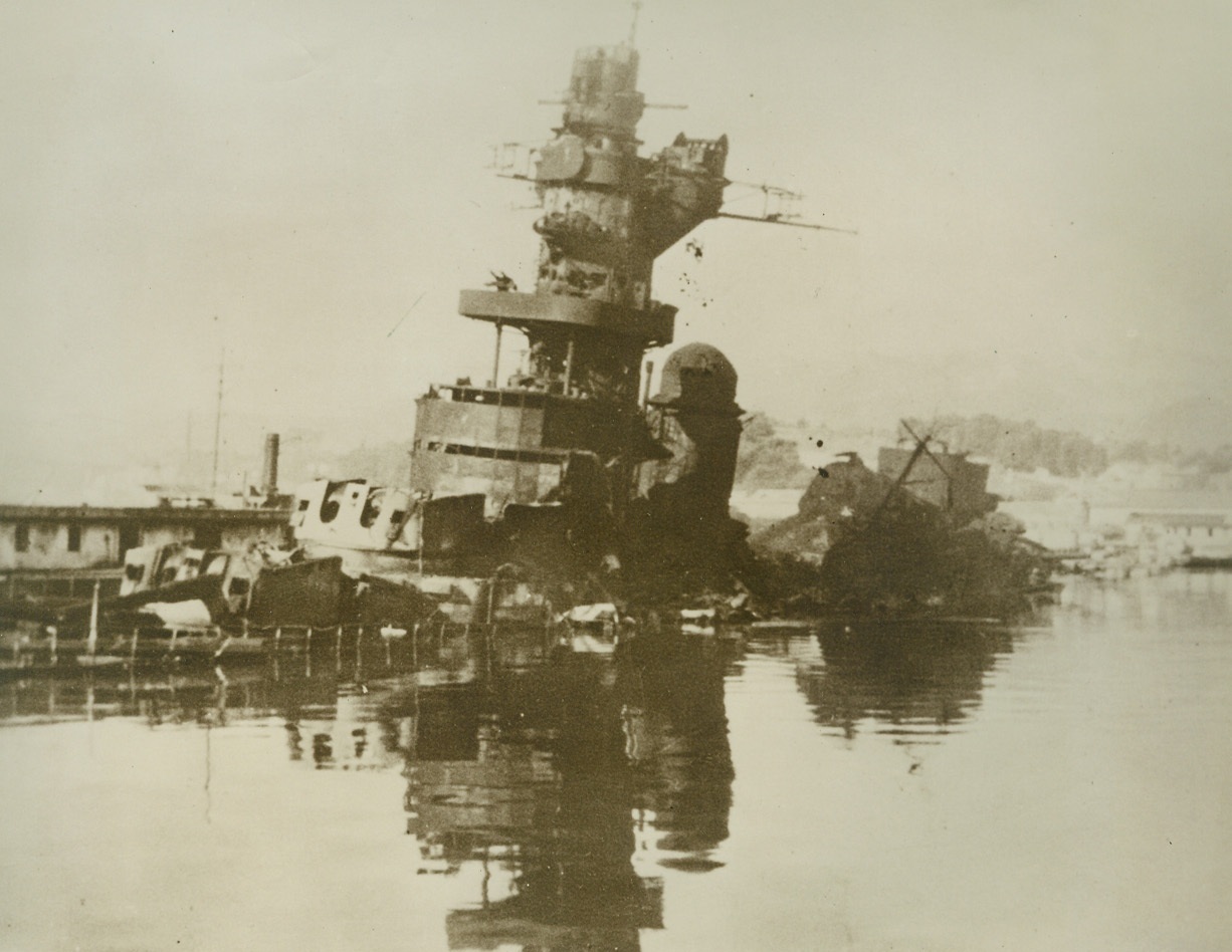 The Mighty Dunquerque at Rest, 3/2/1943. Toulon Harbor -- The battleship Dunquerque lies scuttled in Toulon Harbor with the French Fleet, from lesser auxiliary craft to destroyers and battle-cruisers -- now crewless and derelict. The RAF reported a few hours after the scuttling on November 27th that more than fifty ships were damaged or partly submerged. Ships which were not actually sunk had been dismantled by French sailors before scuttling. Credit: (ACME);