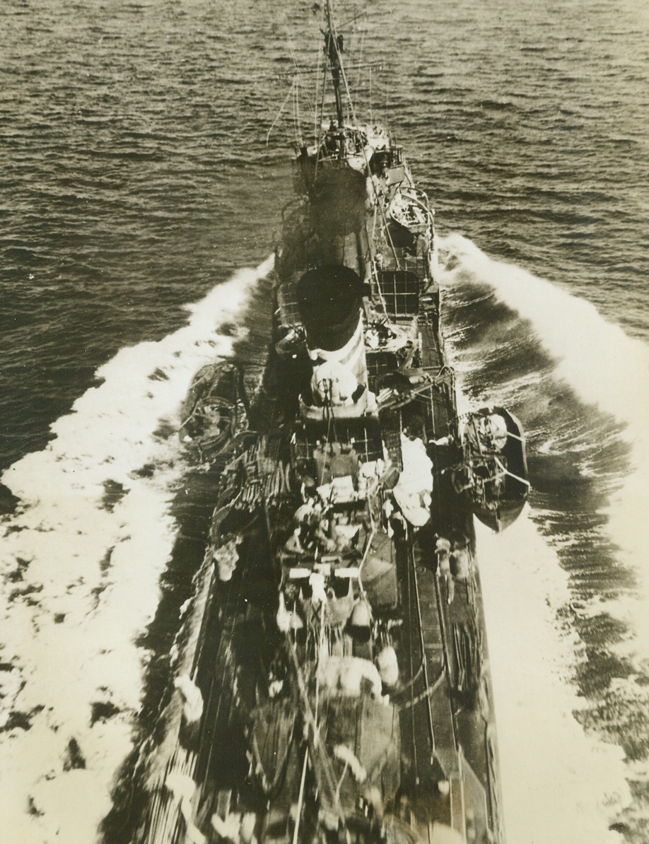 One Way to Get a Jap Destroyer! 3/23/1943. The Allied plane from which this remarkable photo was taken made sure of scoring a “kill” on this Jap destroyer, during the Battle of the Bismarck Sea, by almost scraping the warships smokestacks as it dropped its lethal load. A short time later, the Jap vessel kept a date with “Davy Jones.” Note crew scurrying for cover from the plane they must have thought was going to crash on top of them. Also note logs on the vessel’s decks, which were meant for an invasion attempt that never materialized. The destroyer was one ship of a Jap convoy of 22 vessels completely wiped out in the battle.  Credit: U.S. ARMY AIR FORCES PHOTO FROM ACME.;